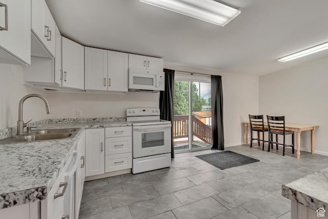 8729 S 3720 W, West Jordan, UT 84088 - kitchen featuring white appliances, white cabinetry, and a sink