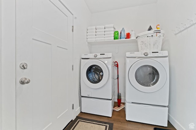 2242 S Beachcomber Ln, Garden City, UT 84028 - washroom featuring baseboards, laundry area, washing machine and dryer, and wood finished floors
