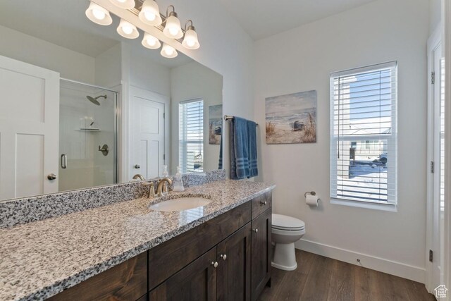 2242 S Beachcomber Ln, Garden City, UT 84028 - bathroom with baseboards, a shower stall, wood finished floors, and a wealth of natural light