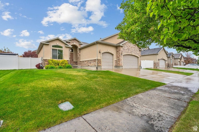 view of front of house with fence, an attached garage, stone siding, stucco siding, and concrete driveway