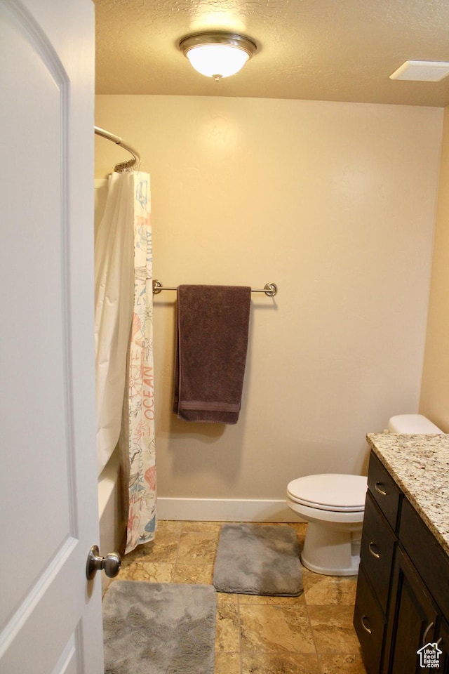 512 Stone Way, Santaquin, UT 84655 - full bathroom with baseboards, a textured ceiling, stone finish flooring, and toilet