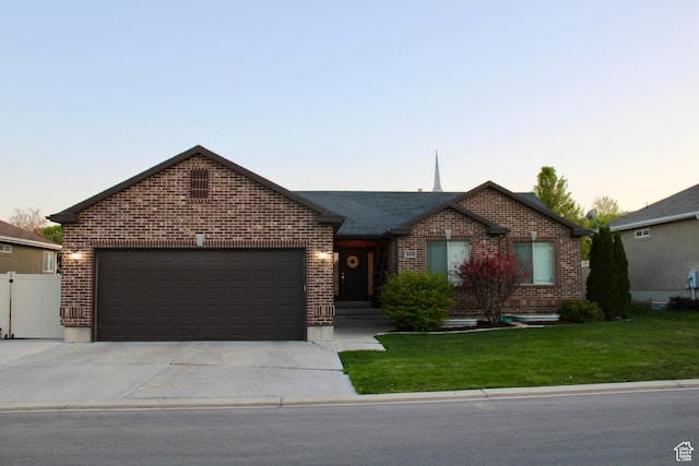 512 Stone Way, Santaquin, UT 84655 - ranch-style house featuring driveway, a front yard, a garage, brick siding, and fence