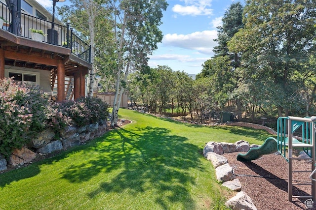 288 S Hillside Dr E, Elk Ridge, UT 84651 - view of yard with a playground and a wooden deck
