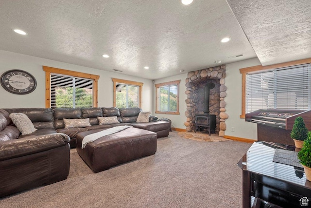 288 S Hillside Dr E, Elk Ridge, UT 84651 - carpeted living area featuring recessed lighting, a textured ceiling, and a wood stove