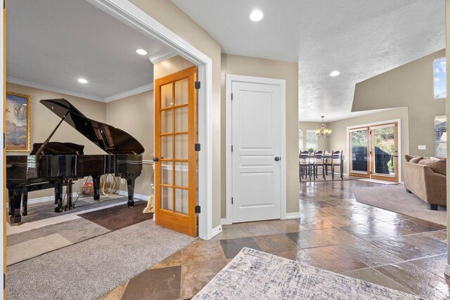 288 S Hillside Dr E, Elk Ridge, UT 84651 - foyer featuring a chandelier, stone tile floors, recessed lighting, baseboards, and ornamental molding
