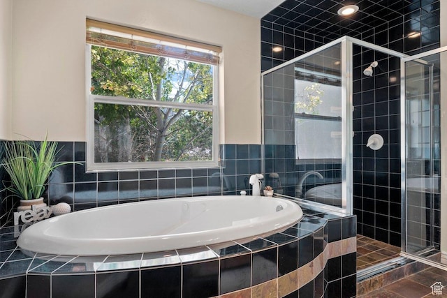 288 S Hillside Dr E, Elk Ridge, UT 84651 - bathroom featuring a garden tub and a stall shower