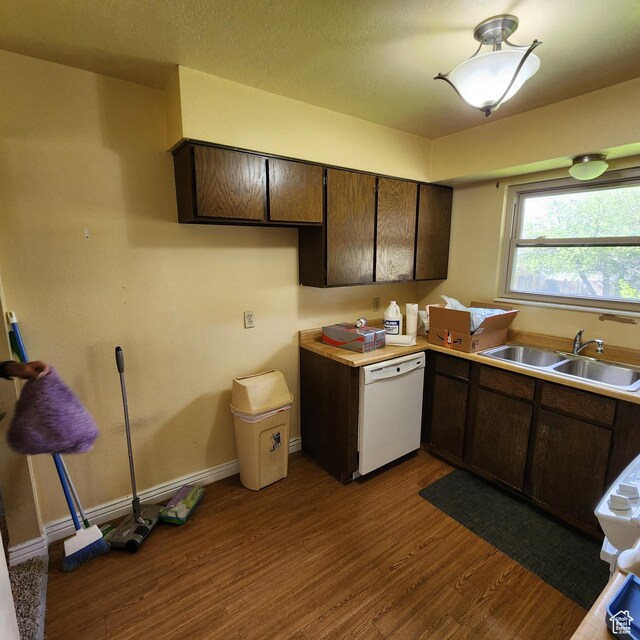 365 E Main St, Grantsville, UT 84029 - kitchen featuring dark brown cabinetry, dark wood finished floors, a sink, and dishwasher