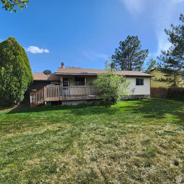 365 E Main St, Grantsville, UT 84029 - rear view of property with a wooden deck, a chimney, and a yard