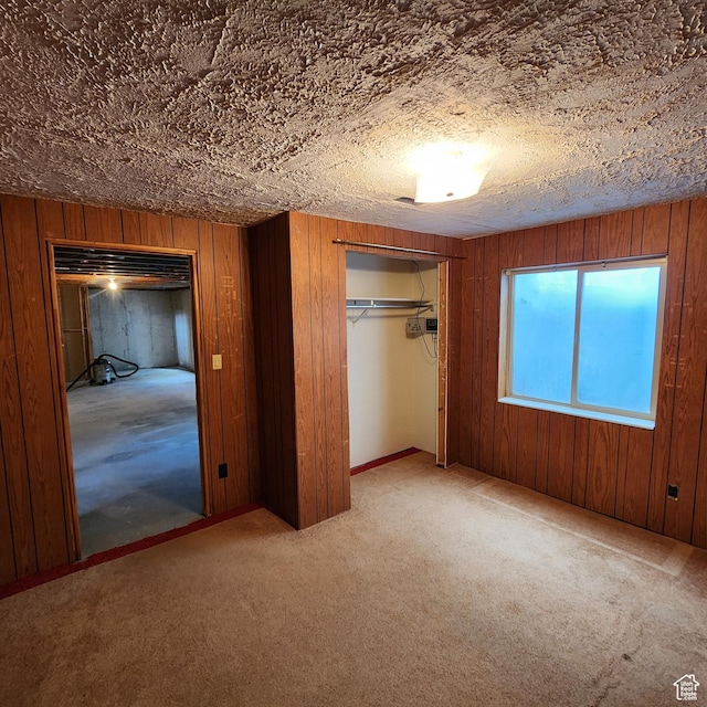 365 E Main St, Grantsville, UT 84029 - unfurnished bedroom with a closet, carpet floors, and wooden walls