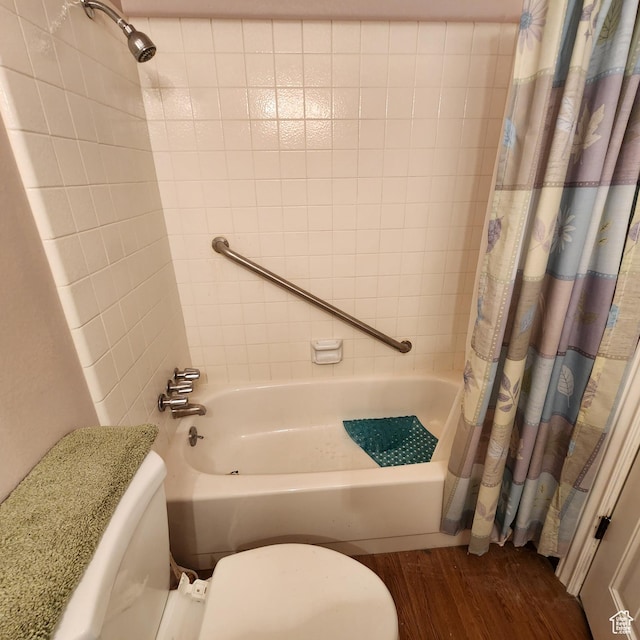 365 E Main St, Grantsville, UT 84029 - bathroom featuring toilet, shower / bathtub combination with curtain, and wood finished floors