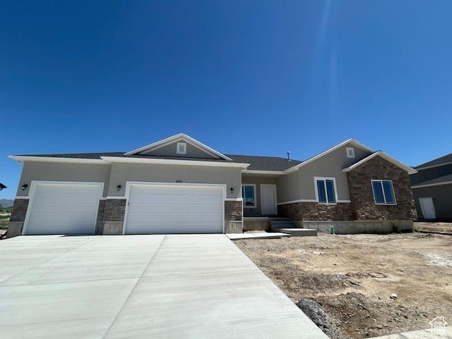 496 N 500 E Lot 5, Salem, UT 84653 - ranch-style house featuring stone siding, stucco siding, a garage, and driveway