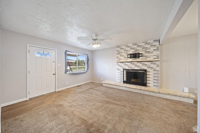 5390 S 4460 W, Kearns, UT 84118 - unfurnished living room with ceiling fan, baseboards, carpet, and a fireplace
