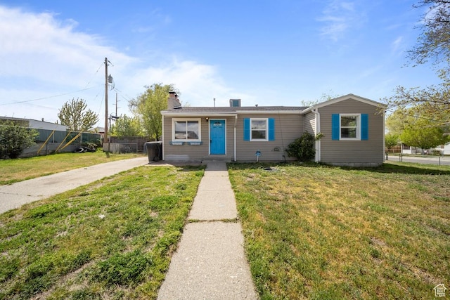 5390 S 4460 W, Kearns, UT 84118 - bungalow-style house with a chimney, fence, and a front yard