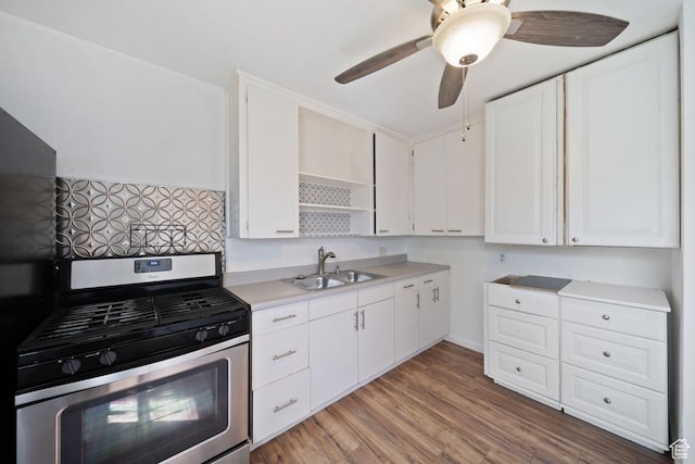5390 S 4460 W, Kearns, UT 84118 - kitchen featuring open shelves, stainless steel gas range, light countertops, white cabinetry, and a sink