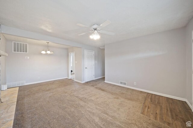 5390 S 4460 W, Kearns, UT 84118 - spare room with visible vents, baseboards, and ceiling fan with notable chandelier
