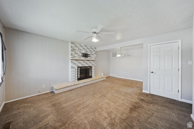 5390 S 4460 W, Kearns, UT 84118 - unfurnished living room with carpet flooring, ceiling fan, a brick fireplace, and baseboards