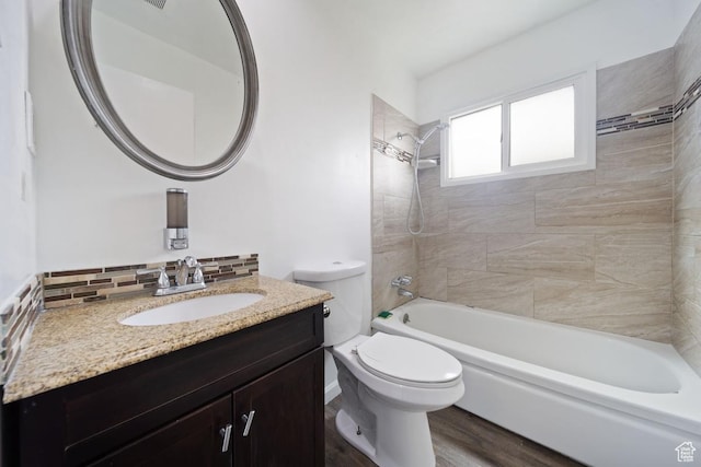 5390 S 4460 W, Kearns, UT 84118 - bathroom featuring backsplash, wood finished floors, vanity, toilet, and  shower combination