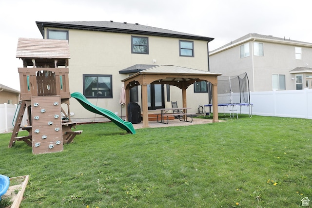 7044 W 8050 S, West Jordan, UT 84081 - back of house with a playground, a gazebo, a fenced backyard, and a trampoline