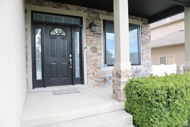 7044 W 8050 S, West Jordan, UT 84081 - entrance to property featuring a porch, stone siding, and stucco siding