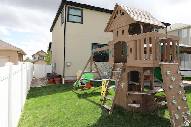7044 W 8050 S, West Jordan, UT 84081 - view of playground featuring a lawn and fence