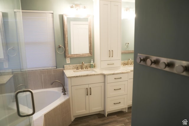 7044 W 8050 S, West Jordan, UT 84081 - bathroom featuring wood finished floors, a bath, and vanity