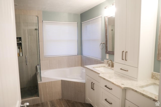 7044 W 8050 S, West Jordan, UT 84081 - full bathroom with a garden tub, a sink, a stall shower, and double vanity