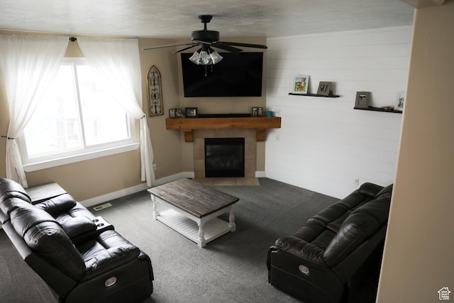 7044 W 8050 S, West Jordan, UT 84081 - carpeted living room with a tiled fireplace, baseboards, a ceiling fan, and visible vents