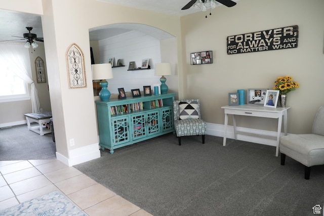 7044 W 8050 S, West Jordan, UT 84081 - sitting room featuring carpet flooring, tile patterned flooring, arched walkways, a ceiling fan, and baseboards
