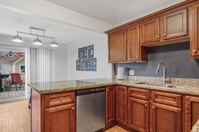 6888 S Hillside Village Cir, Salt Lake City, UT 84121 - kitchen featuring light stone counters, a sink, light wood-style flooring, a peninsula, and stainless steel dishwasher