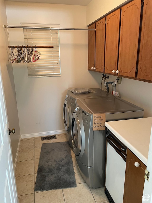 1846 E 9800 S, Sandy, UT 84092 - laundry room with visible vents, cabinet space, baseboards, separate washer and dryer, and light tile patterned flooring