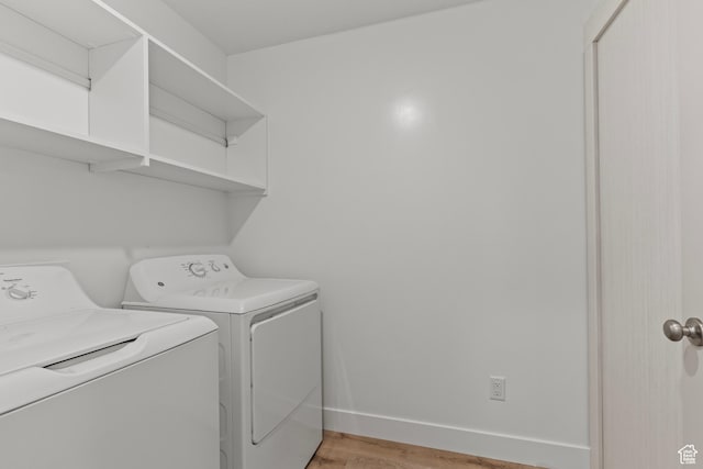 3372 S 1010 W, Nibley, UT 84321 - laundry area with laundry area, baseboards, separate washer and dryer, and light wood-type flooring
