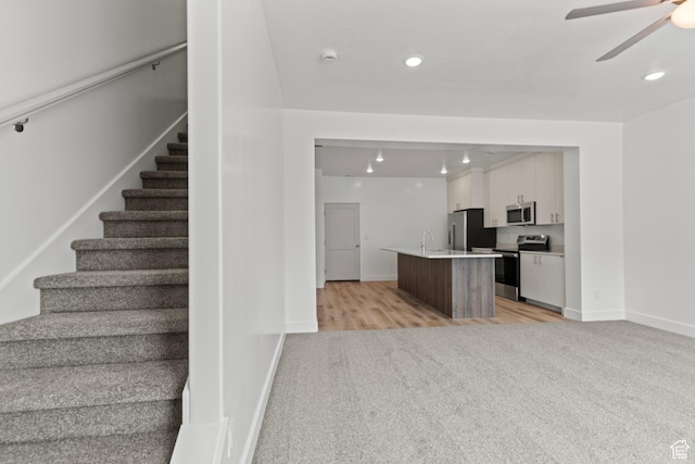 3372 S 1010 W, Nibley, UT 84321 - stairway with baseboards, carpet, a ceiling fan, and recessed lighting