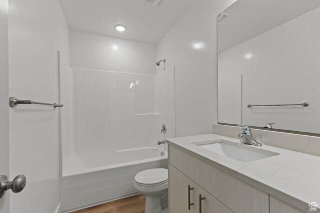 3372 S 1010 W, Nibley, UT 84321 - bathroom with shower / bathtub combination, toilet, wood finished floors, and vanity