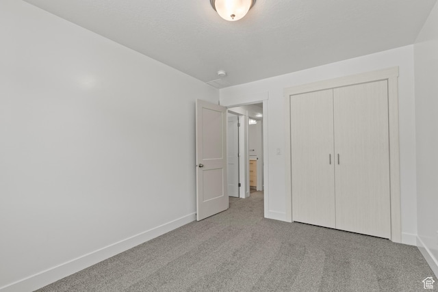 3372 S 1010 W, Nibley, UT 84321 - unfurnished bedroom with a closet, baseboards, and carpet flooring