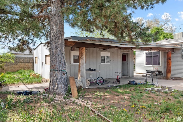 4207 W 5655 S, Salt Lake City, UT 84118 - back of property featuring a patio and board and batten siding