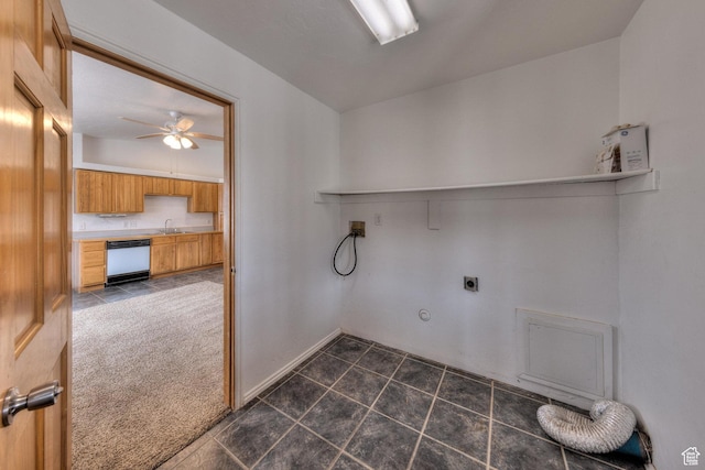 3971 S Spanish Valley Dr, Moab, UT 84532 - clothes washing area with laundry area, dark tile patterned floors, a sink, washer hookup, and hookup for an electric dryer