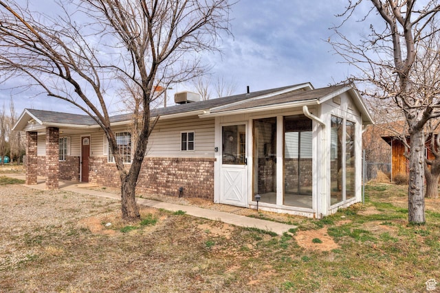 3971 S Spanish Valley Dr, Moab, UT 84532 - view of front of property with a sunroom and brick siding