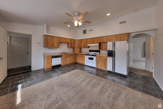 3971 S Spanish Valley Dr, Moab, UT 84532 - kitchen featuring visible vents, white appliances, baseboards, under cabinet range hood, and a ceiling fan