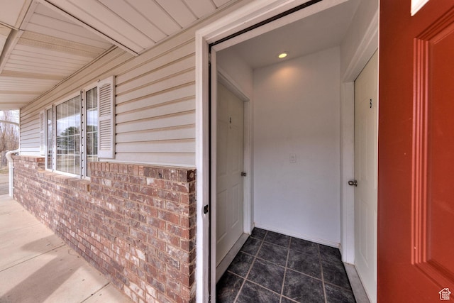 3971 S Spanish Valley Dr, Moab, UT 84532 - property entrance featuring a porch and brick siding