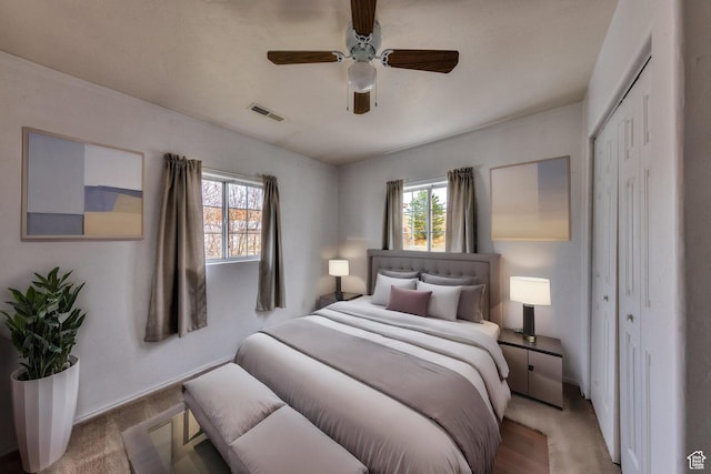 3971 S Spanish Valley Dr, Moab, UT 84532 - bedroom featuring visible vents, a ceiling fan, a closet, and multiple windows