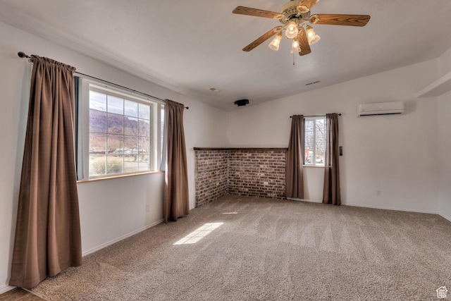 3971 S Spanish Valley Dr, Moab, UT 84532 - carpeted empty room with an AC wall unit, a ceiling fan, vaulted ceiling, and baseboards