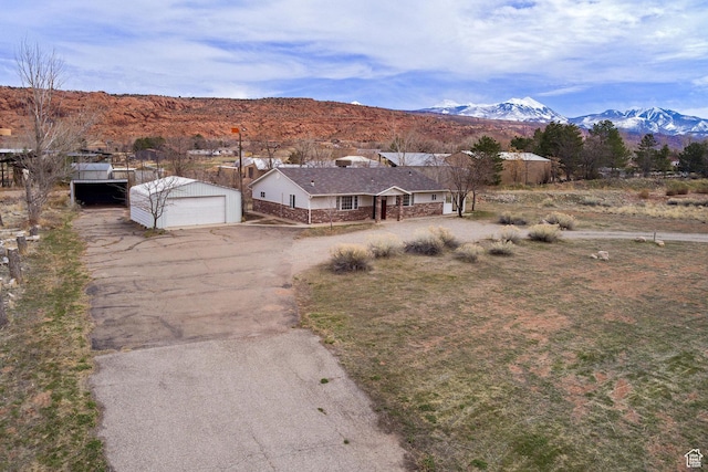 3971 S Spanish Valley Dr, Moab, UT 84532 - drone / aerial view featuring a mountain view