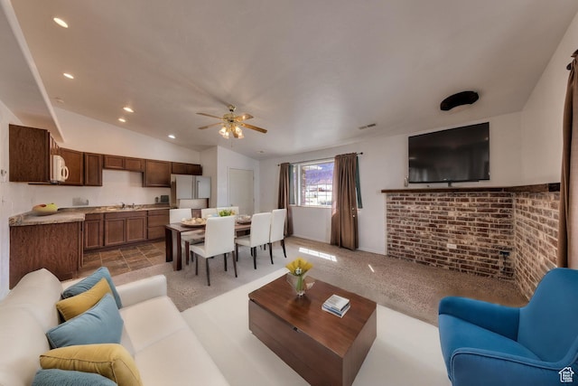 3971 S Spanish Valley Dr, Moab, UT 84532 - living area with visible vents, lofted ceiling, recessed lighting, light colored carpet, and a ceiling fan