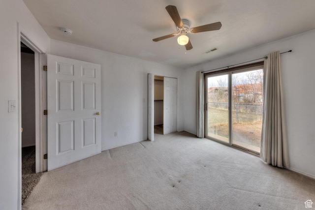 3971 S Spanish Valley Dr, Moab, UT 84532 - unfurnished bedroom featuring carpet flooring, ceiling fan, access to exterior, visible vents, and a closet