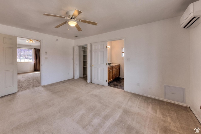 3971 S Spanish Valley Dr, Moab, UT 84532 - unfurnished bedroom with a ceiling fan, carpet flooring, ensuite bath, and a wall unit AC