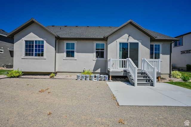 2770 S Sinbad Way W, Magna, UT 84044 - view of front facade featuring central air condition unit, stucco siding, and a patio area