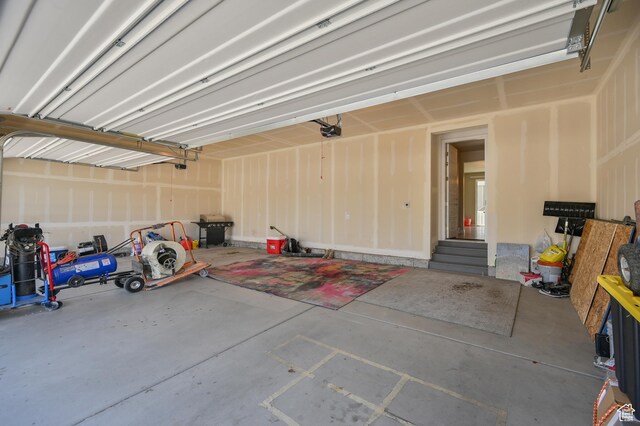 2770 S Sinbad Way W, Magna, UT 84044 - garage featuring a garage door opener
