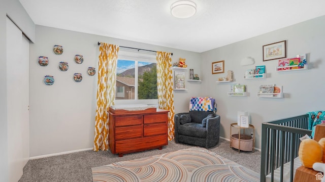 875 E 1150 S Unit 21, Ogden, UT 84404 - carpeted bedroom with baseboards and a crib