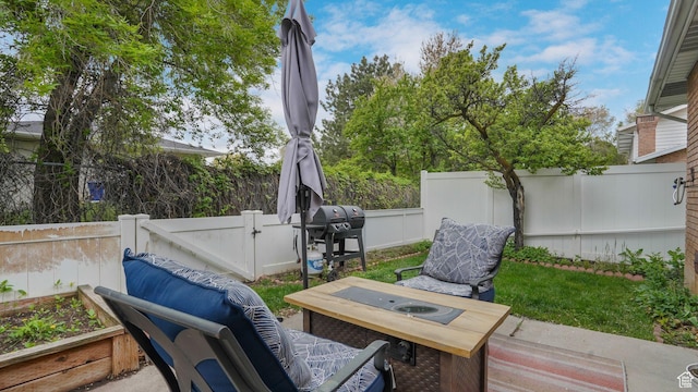 875 E 1150 S Unit 21, Ogden, UT 84404 - view of patio / terrace with a fenced backyard and a grill