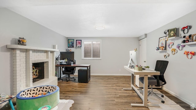 875 E 1150 S Unit 21, Ogden, UT 84404 - office area with a brick fireplace, baseboards, and wood finished floors